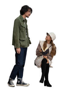 cut out woman sitting on a bench talking to a man standing beside her