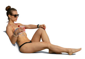 cut out woman sunbathing and drinking cocktail