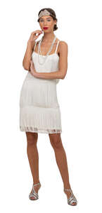 cut out woman in a vintage white flapper dress standing