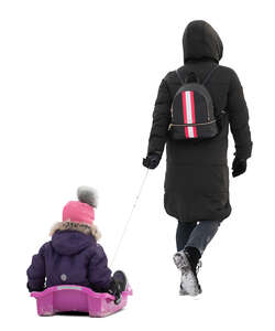 cut out woman walking and pulling child sitting on the sledge