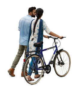 cut out indian couple with a bicycle walking