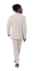cut out black man in a white suit walking