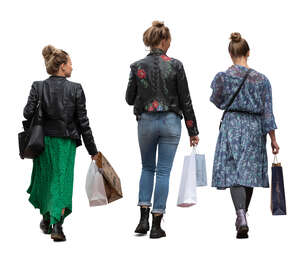 three cut out women with shopping bags walking