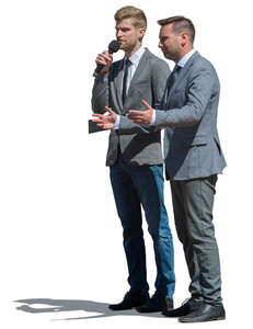 two men talking to a microphone