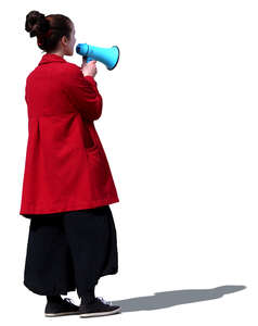 woman standing and talking into a megaphone