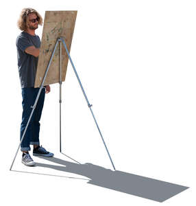 young man standing and drawing