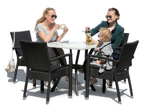 two women and a little boy sitting in a cafe