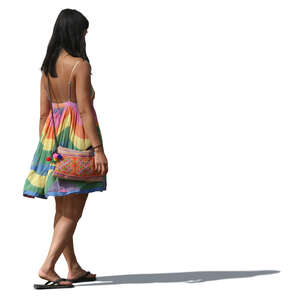 woman in a colorful summer dress walking