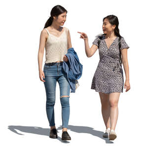 two young asian women walking on a sunny street