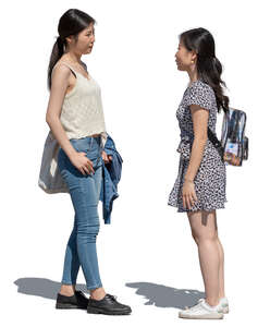 two young asian women standing and talking