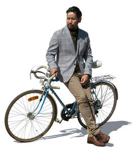 cut out japanese man standing and leaning against his bike