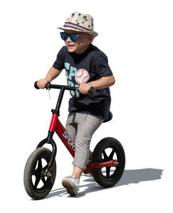 cut out little happy boy riding a bicycle