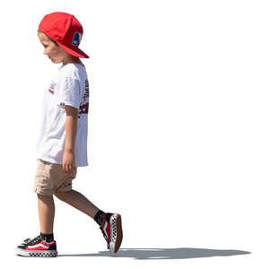 boy with a red hat walking