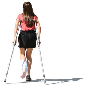young girl walking with crutches
