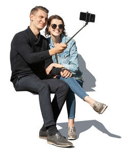 couple sitting and taking a selfie