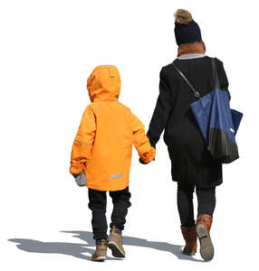 mother and child in winter clothes walking hand in hand