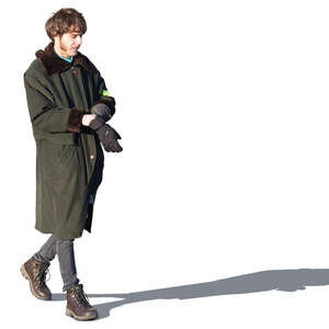 man in a winter coat walking