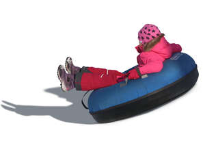 little girl snowtubing