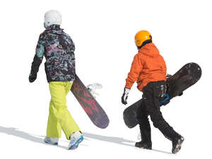 two people with snowboards walking