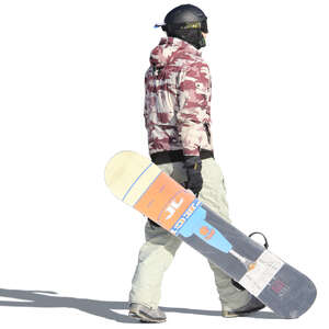 young man walking and carrying a snowboard