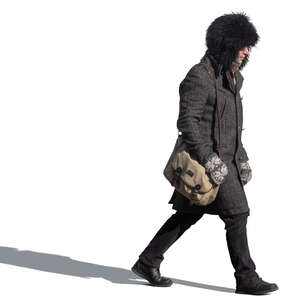 man with a fur winter hat walking