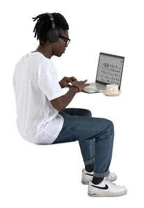 cut out man working with a laptop and drinking coffee