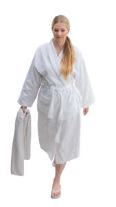 cut out woman in a white bathrobe walking seen from above