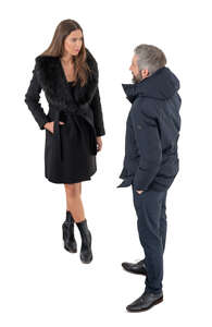 cut out man and woman in overcoats standing seen from above