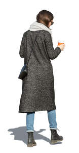 cut out woman in an overcoat walking and drinking coffee