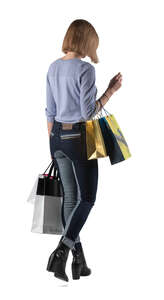 cut out woman with many shopping bags walking