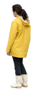 cut out woman in a yellow raincoat standing