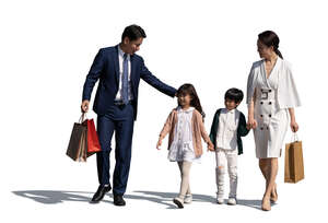 cut out asian family with two kids and shoppping bags walking