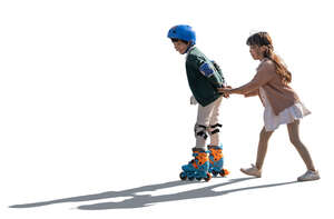 two cut out backlit kids roller skating