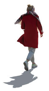 cut out backlit woman wearing an overcoat walking