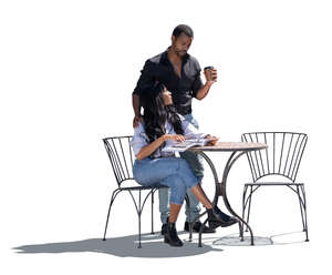 cut out black backlit couple sitting outside at a table and talking