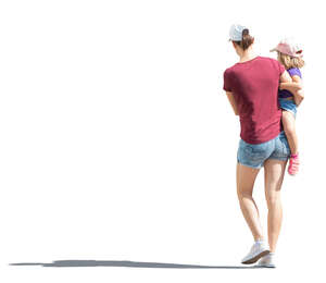 cut out woman walking and carrying a child in her arms