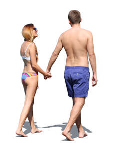 cut out couple at a beach walking hand in hand