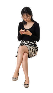 cut out asian woman sitting and texting