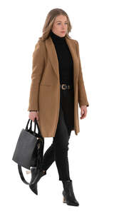 cut out woman in a brown overcoat walking