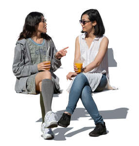 two cut out young asian women sitting and talking