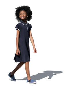 cut out little smiling black girl in a blue summer dress walking