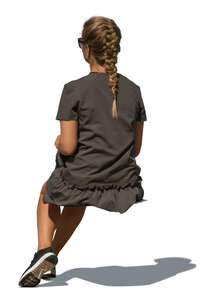 cut out young woman sitting seen from back angle