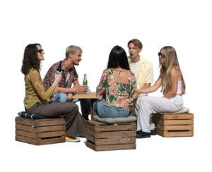 cut out group of five young people sitting in an outdoor cafe