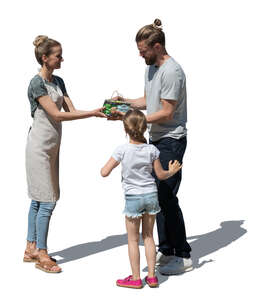 cut out man with a daughter buying grapes on farmers market