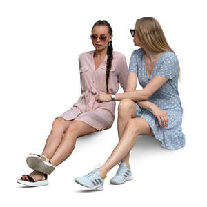 two cut out women sitting and talking