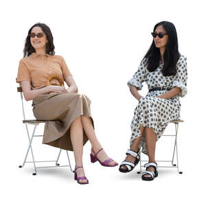 two cut out women sitting casually and smiling