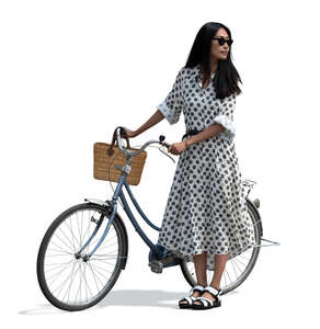 cut out asian woman in a summer dress standing and holding a bicycle