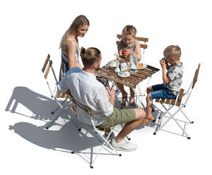 cut out family sitting in an outdoor restaurant seen from above