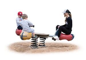 three cut out children playing on the playground