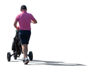 cut out golf player with a golf trolley walking